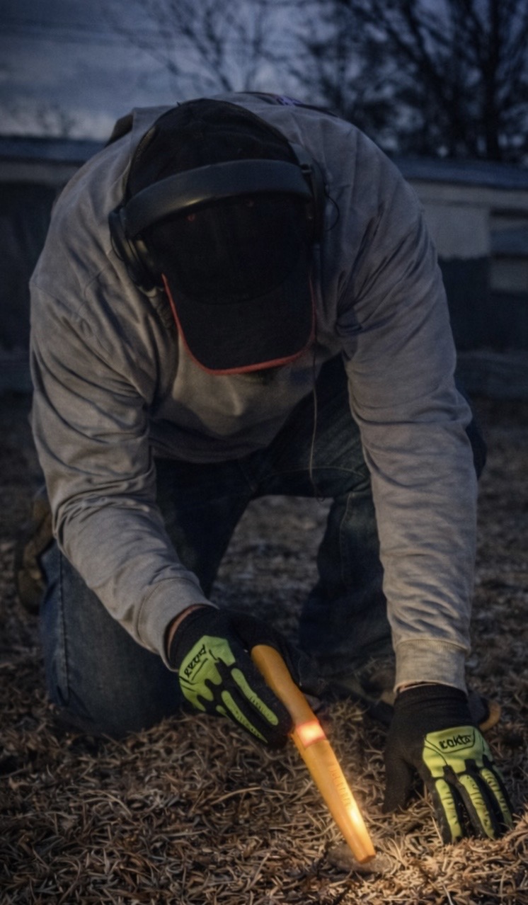 Metal detector scanning an open field in Nebraska